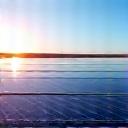 Clean solar panels reflecting the sun